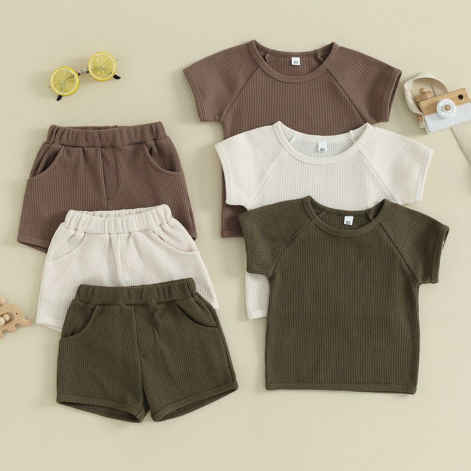 Waffle Short-sleeved 2-piece Baby Clothes in various colors, including brown and cream, perfect for baby wear.